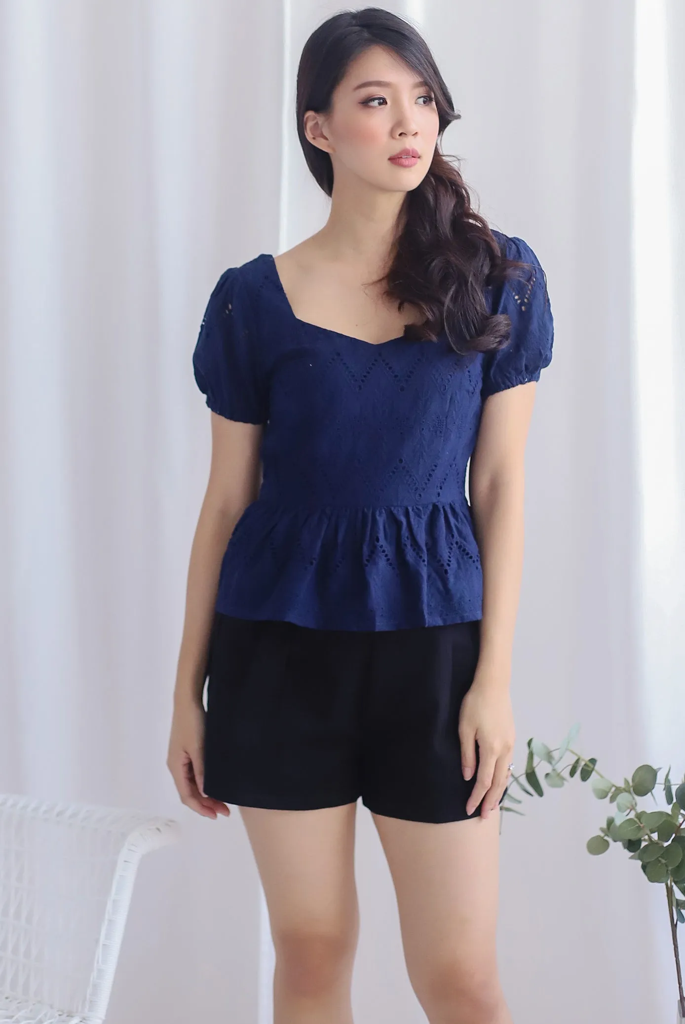 Amie Eyelet Pelum Top In Navy Blue