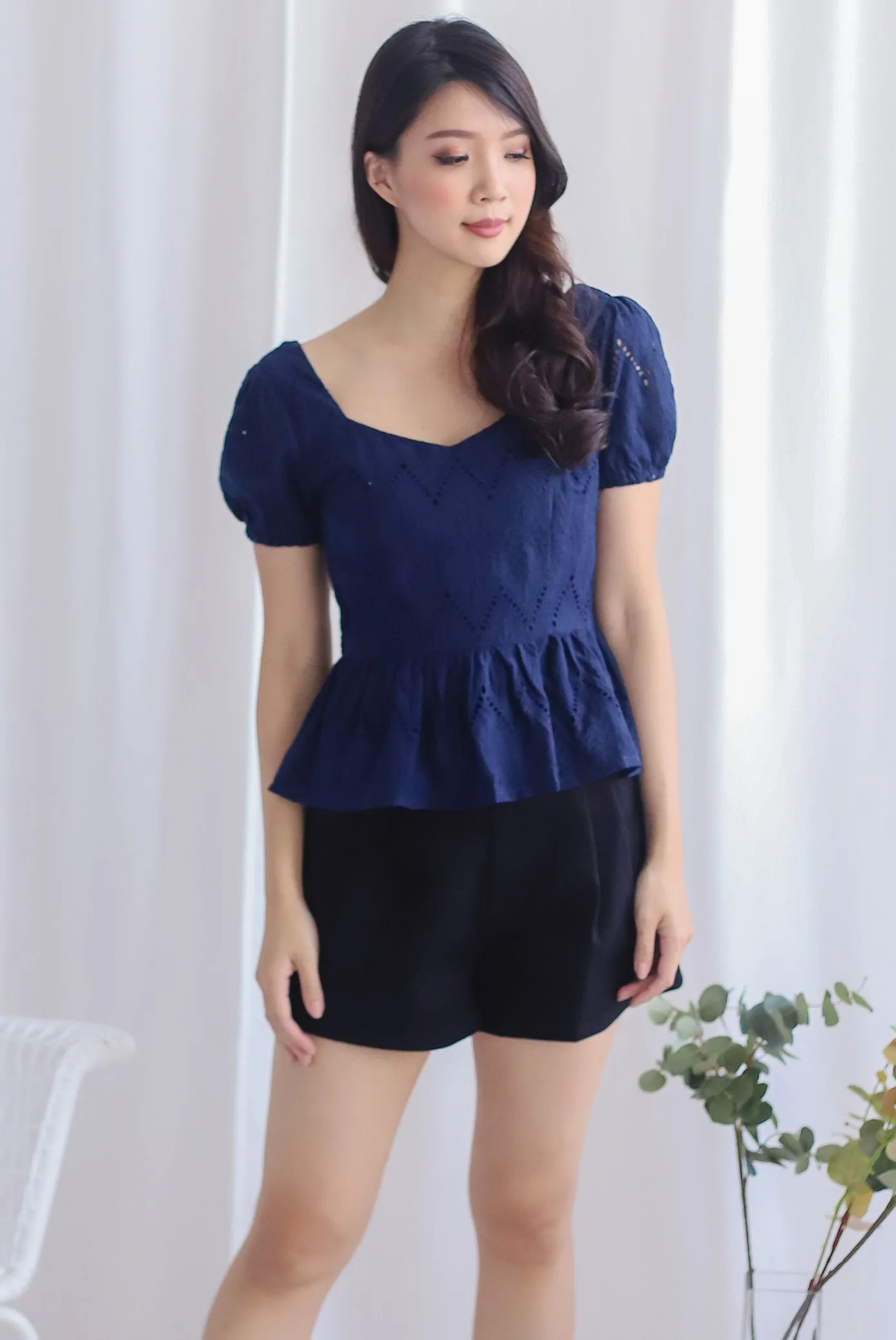 Amie Eyelet Pelum Top In Navy Blue
