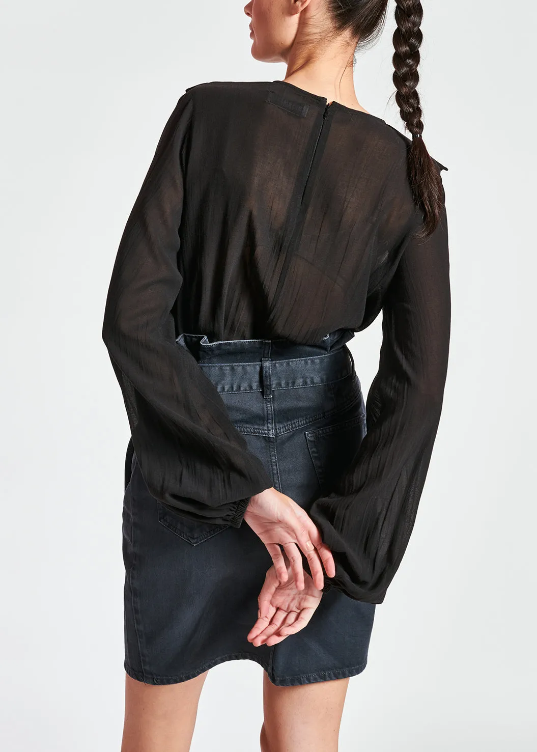 Black sequin-embroidered top with ruffles