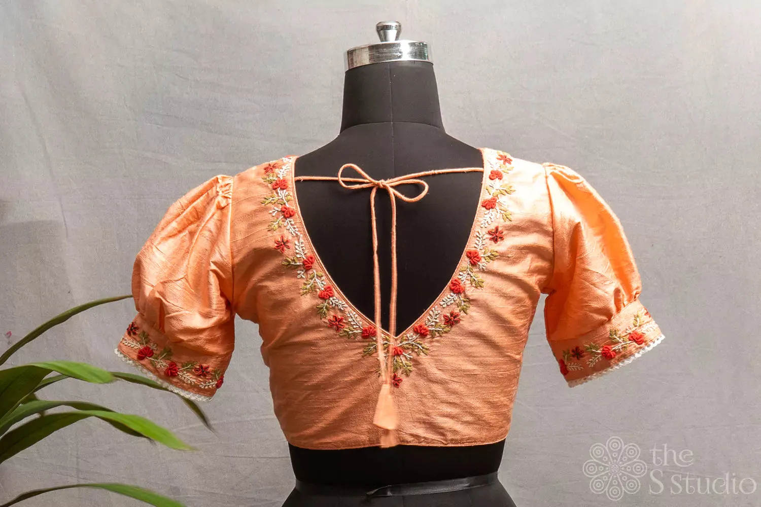 Peach  raw silk readymade blouse with hand embroidery.