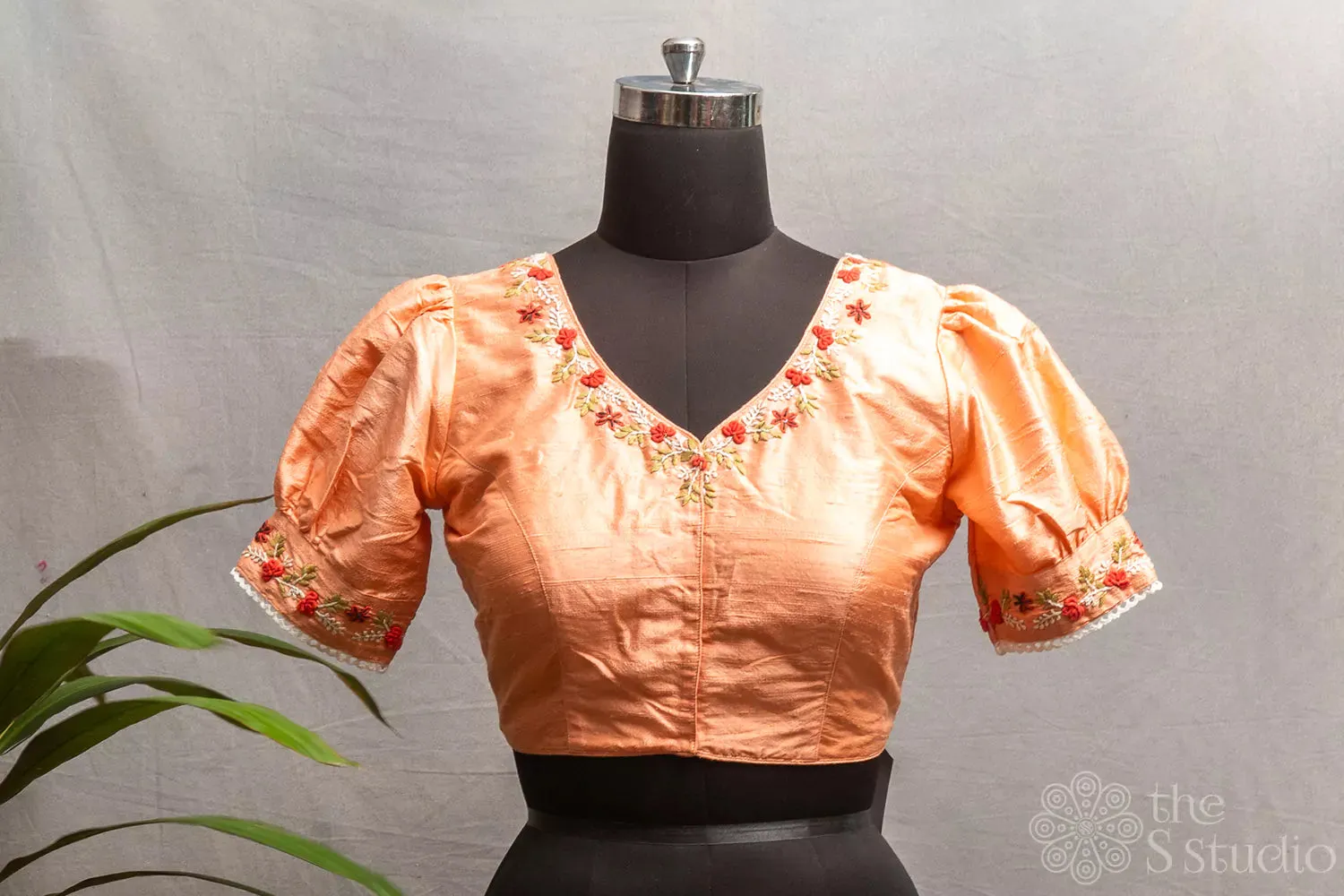 Peach  raw silk readymade blouse with hand embroidery.